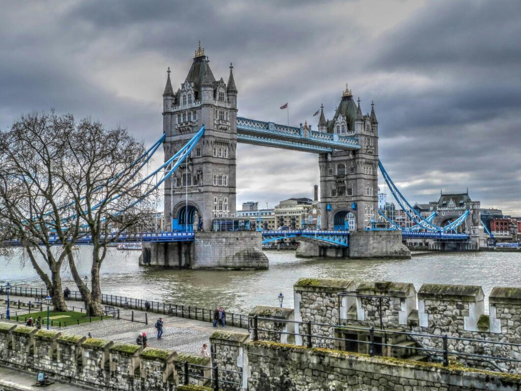 Scenic view of Tower Bridge over the Thames with cloudy sky in London.
